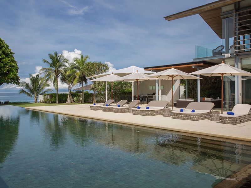 Aerial view of 39-bedroom beachfront estate on Natai Beach, Phuket, with multiple swimming pools and direct beach access