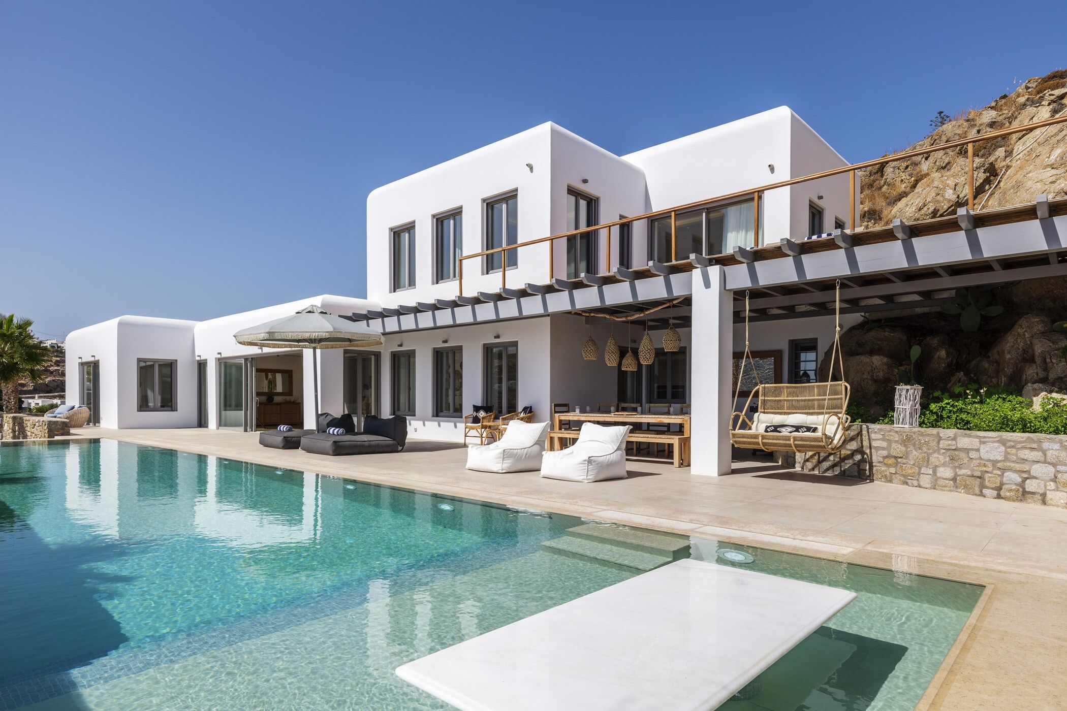 View of the exterior at luxury villa Beach Love, with the swimming pool in the foreground