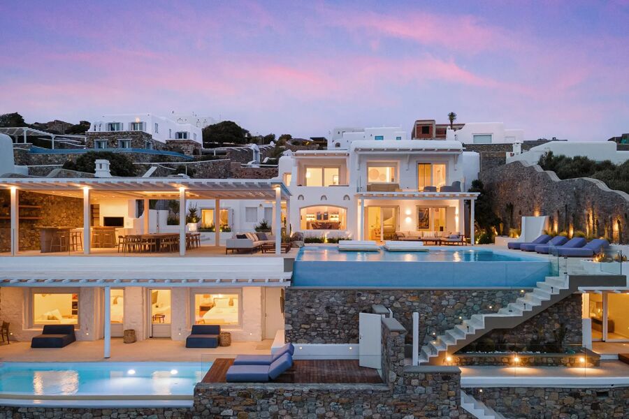 Sunset at luxury rental Villa Mag in Mykonos, split over multiple floors with several pools from Bluemoon