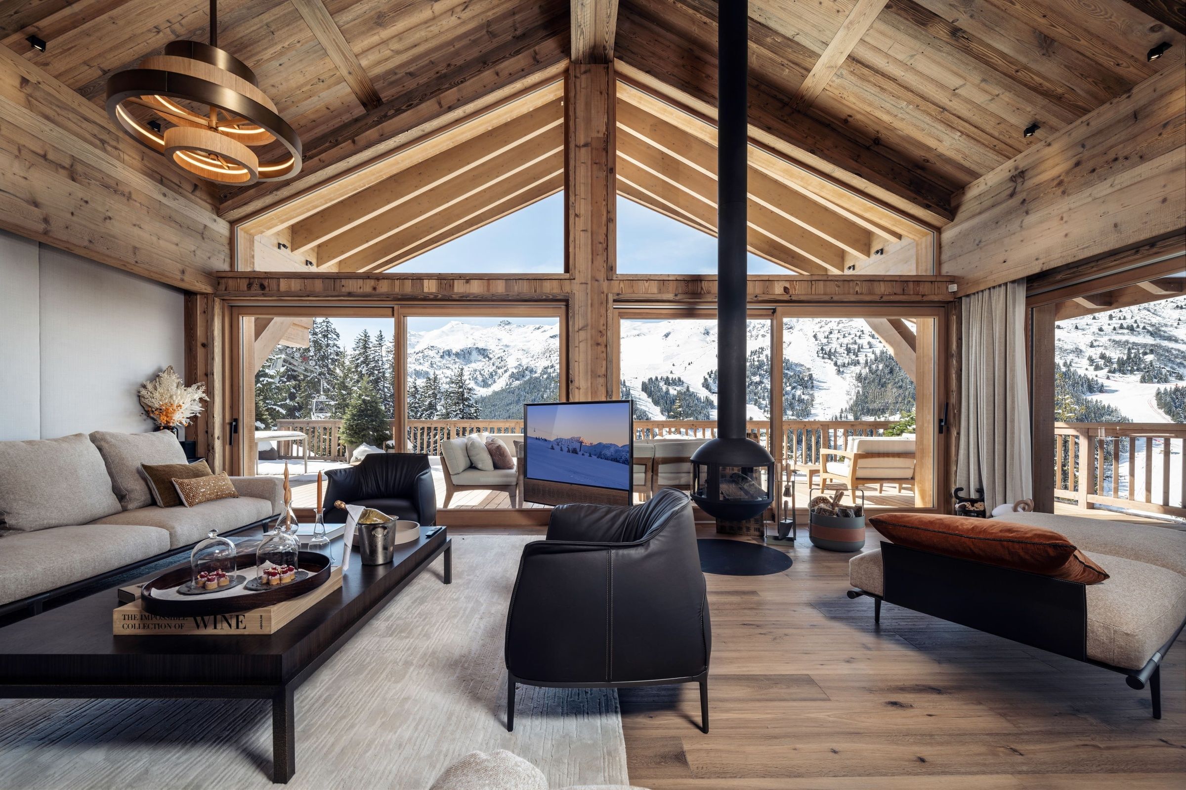 Chalet Luna living room with dark timber and valley view