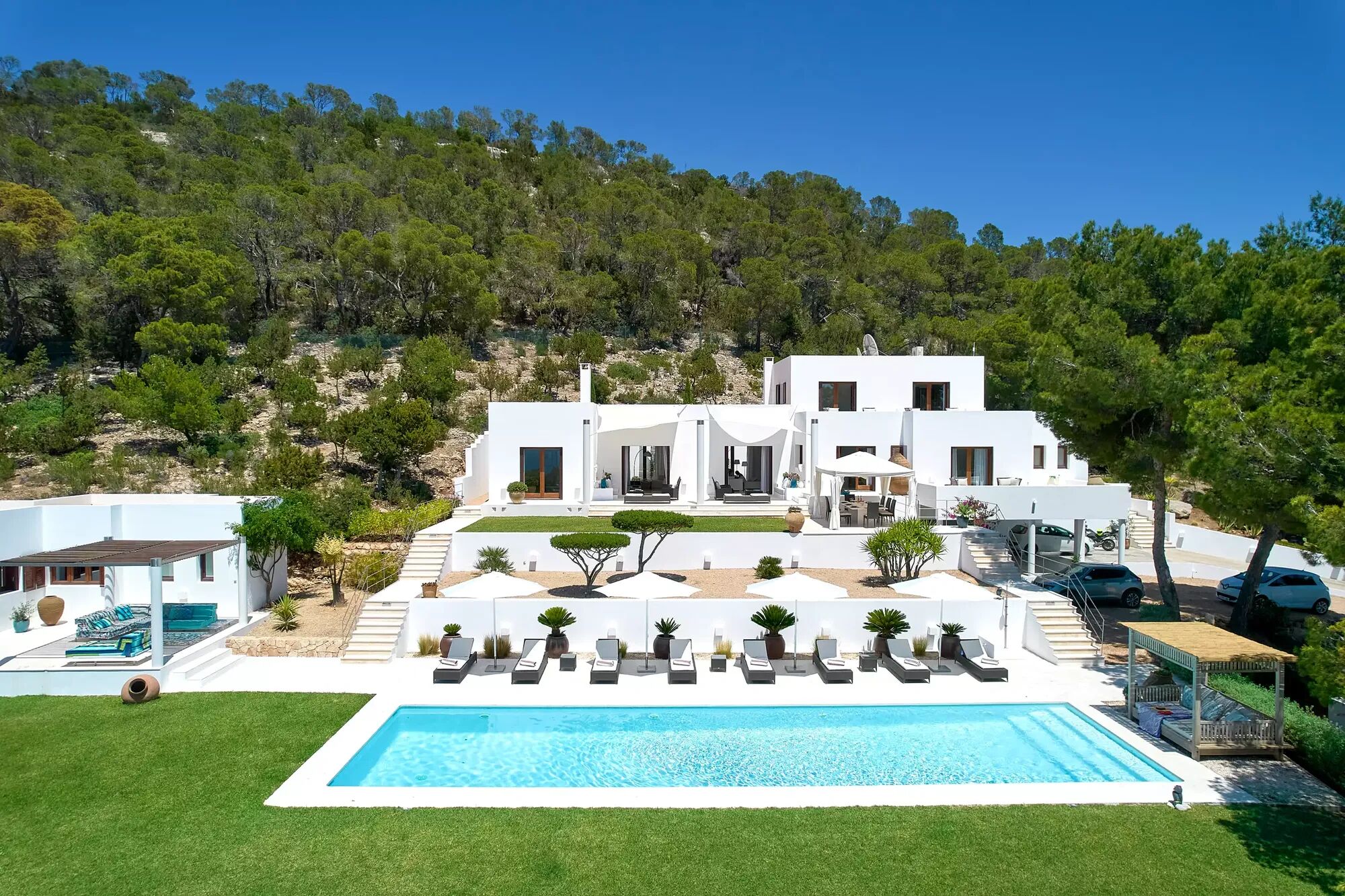 The exterior of rental Villa Aleni in Ibiza set amongst the hills