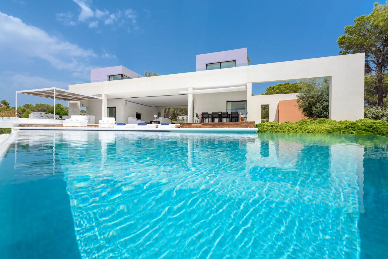 Modern Villa Viola rental from Bluemoon with sleek design, including a spacious pool, stylish outdoor furniture, and surrounded by tropical plants.