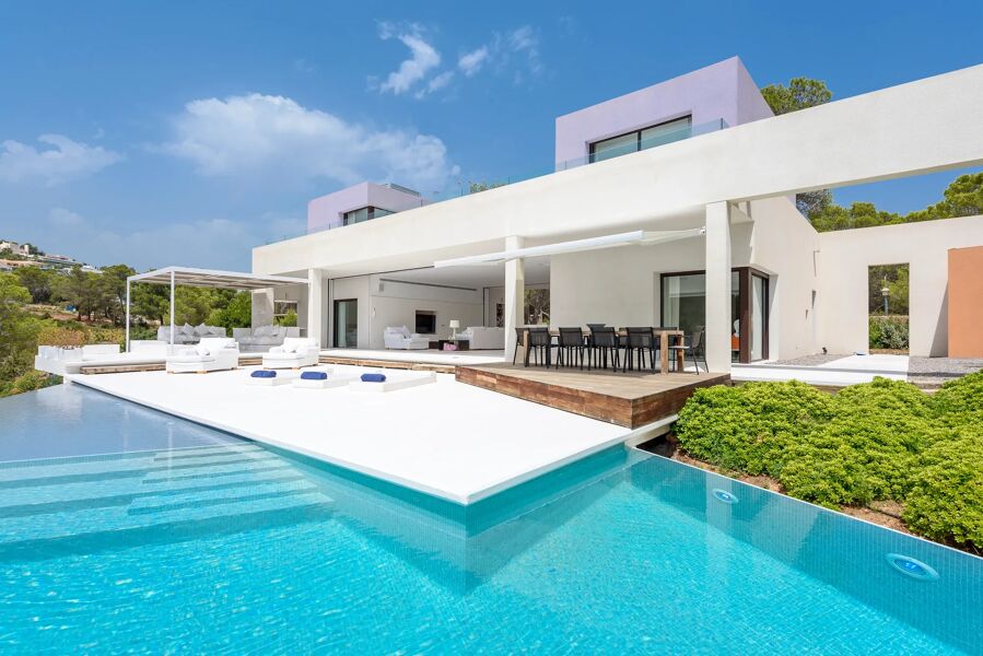 The gorgeous pool that leads out to the dining area in the back of luxury rental Villa Viola in Ibiza