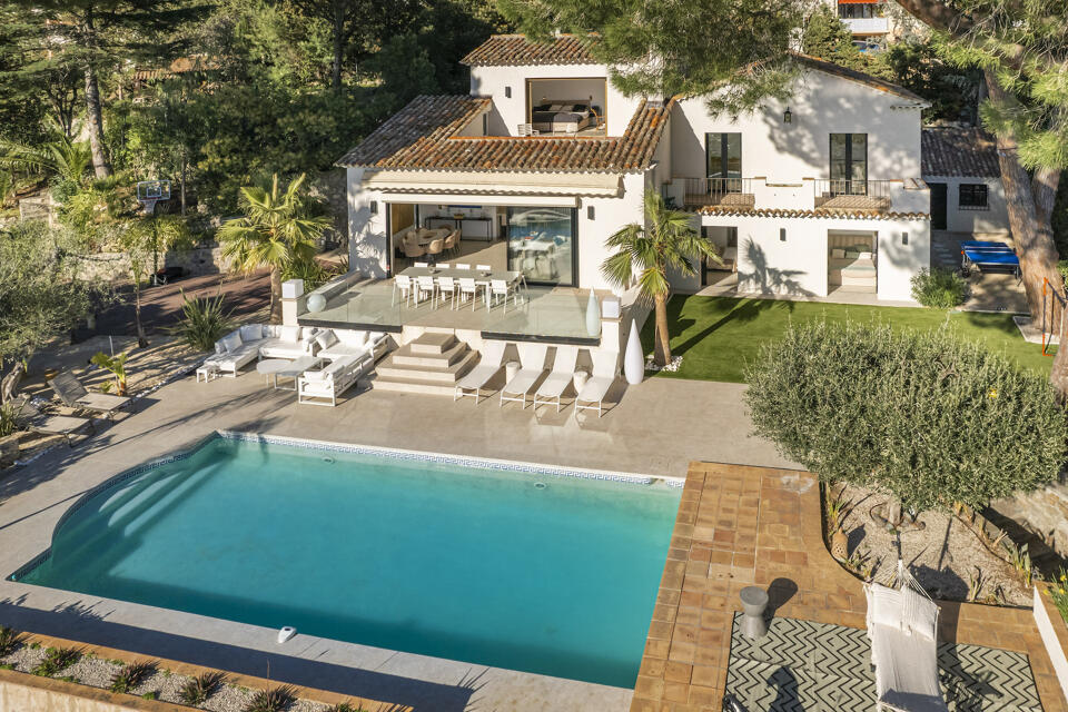 Charming Villa Amelia in Cannes with terracotta roof, modern outdoor terrace, and a heated saltwater pool overlooking the Mediterranean