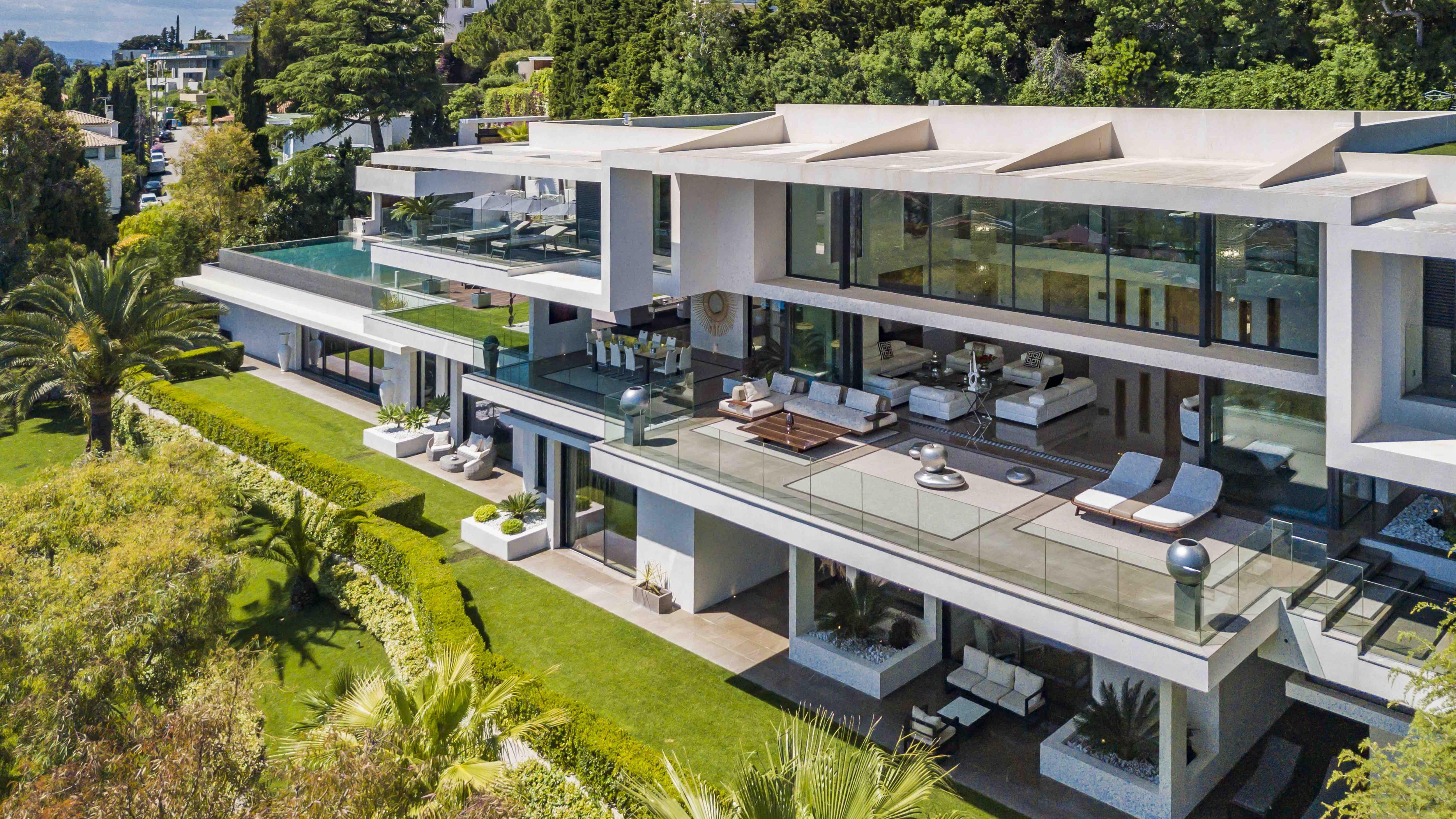 Ultra-luxury Villa Cassiopeia in Super Cannes with panoramic sea views, sleek modern architecture, and infinity pool surrounded by lush gardens