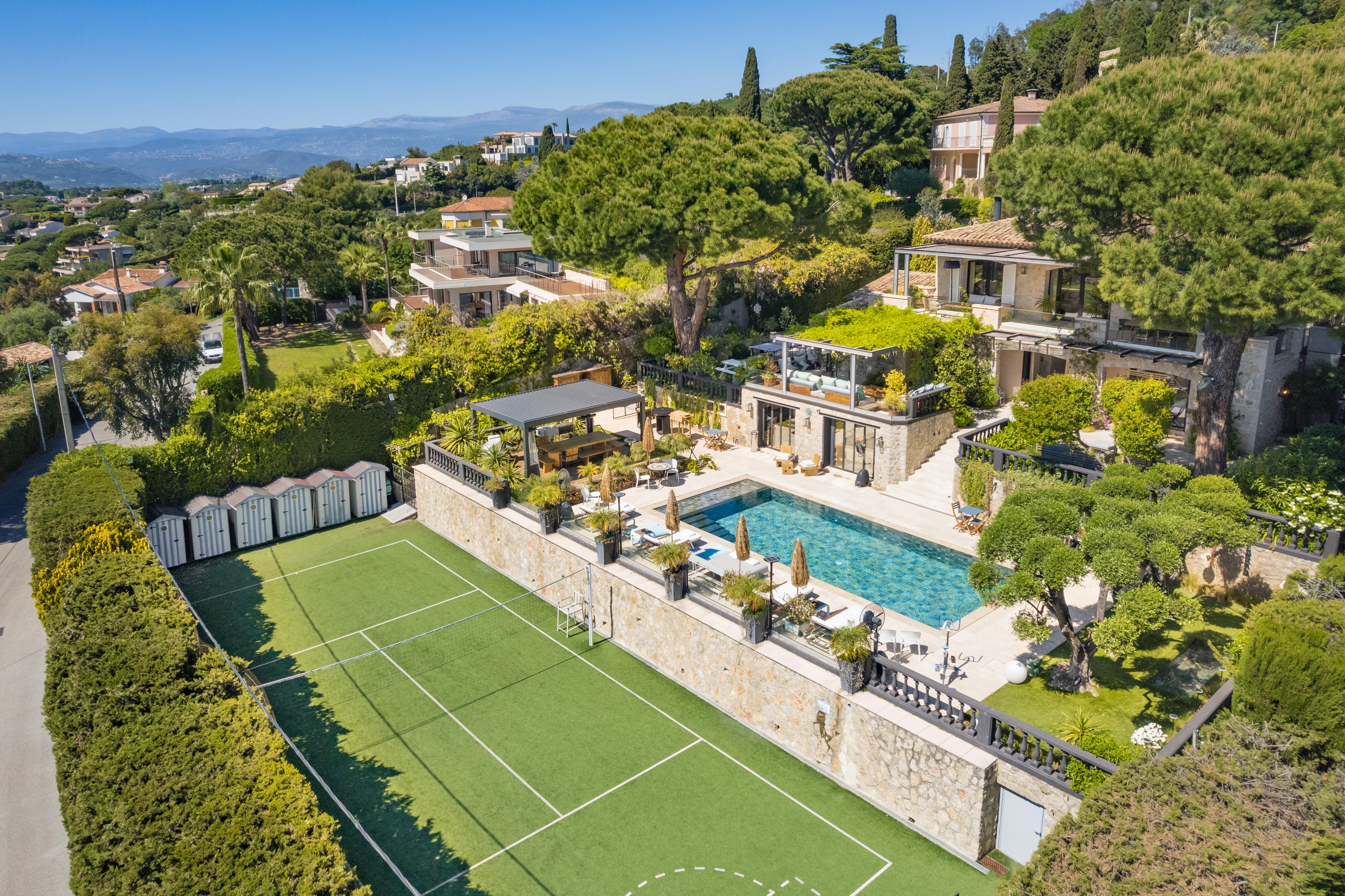 Private tennis and basketball court at Villa Emma with sweeping views over Cannes, set beneath landscaped gardens and luxury terraces