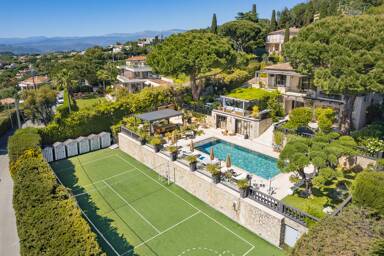 Private tennis and basketball court at Villa Emma with sweeping views over Cannes, set beneath landscaped gardens and luxury terraces
