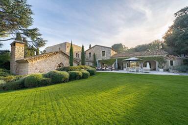 Stone-built Villa Paradis in Vallauris with manicured lawn and Provencal architecture, set within vast private gardens on the French Riviera