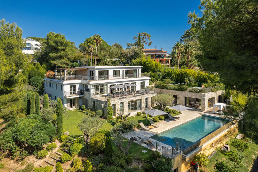 Contemporary Villa Phoenix in Cannes with terraced gardens, panoramic sea views, and a sleek infinity pool overlooking the Bay of Cannes