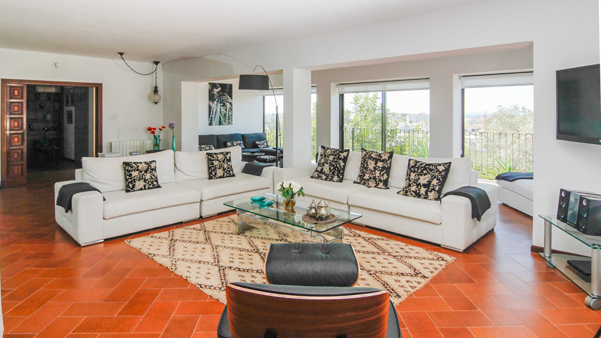 Living space in Can Bab in Ibiza with sunlight streaming in and two large sofas
