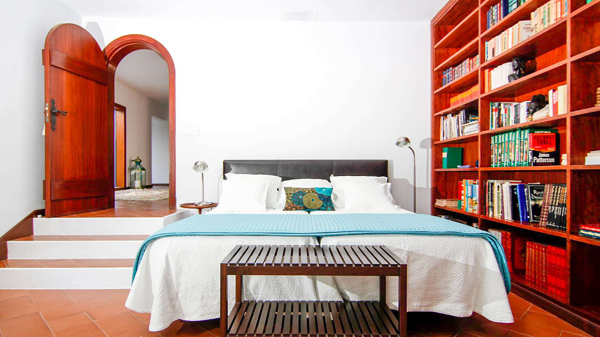 One of the bedrooms in Can Bab in Ibiza with a beautiful library a haven for readers