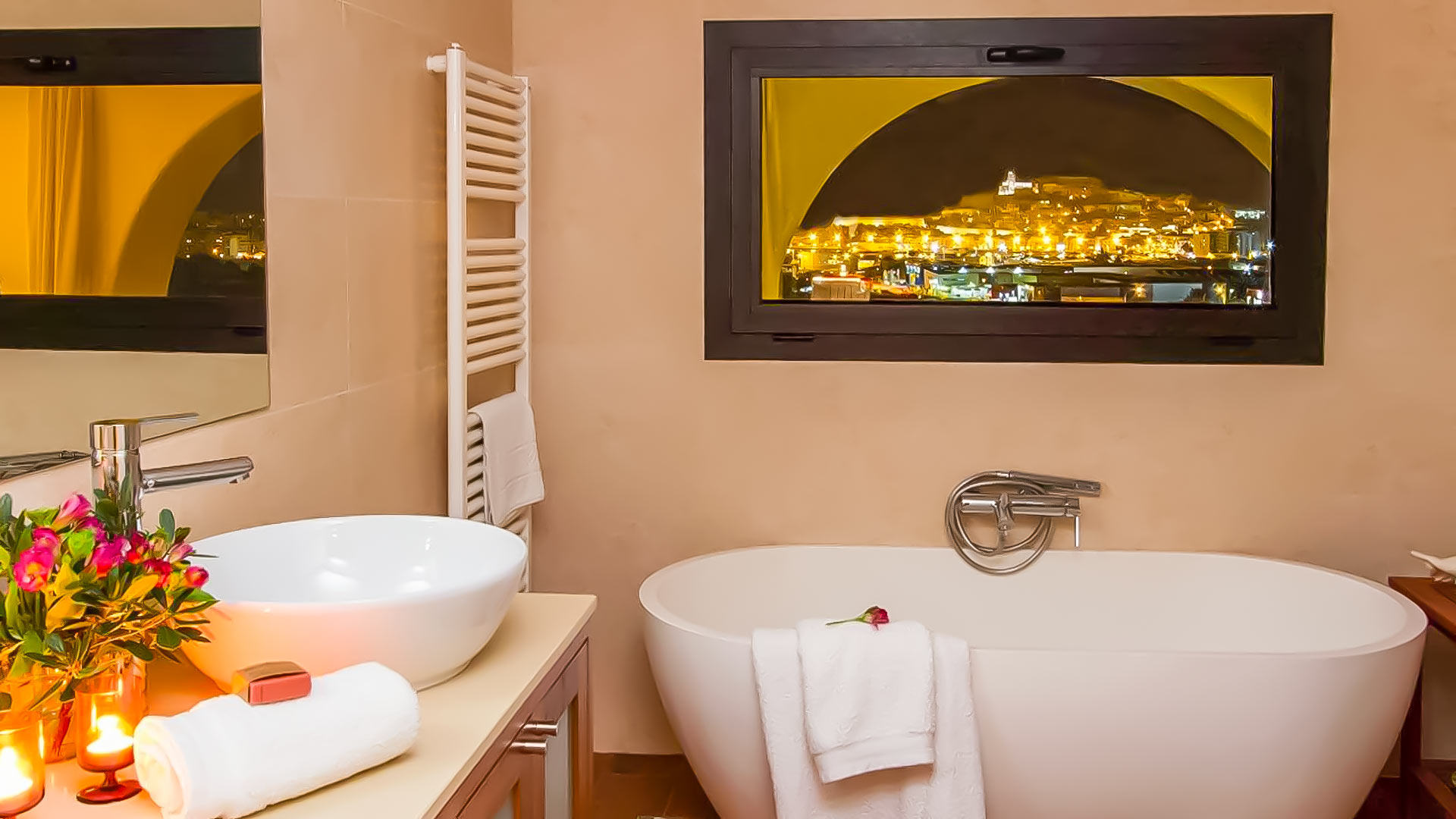 Bathroom with views of Ibiza and a large tub to enjoy during your luxury stay at Can Bab in Ibiza