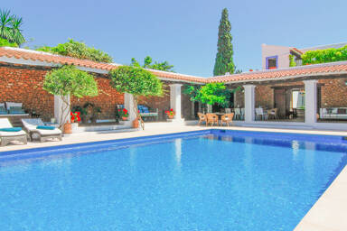 Large swimming pool and sunloungers at Can Bab in Ibiza