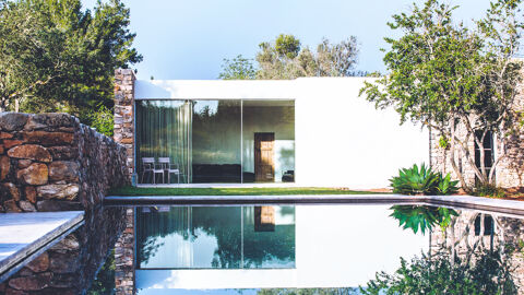 Villa Can Basso in Ibiza's swimming pool and the a view into the living space from outside