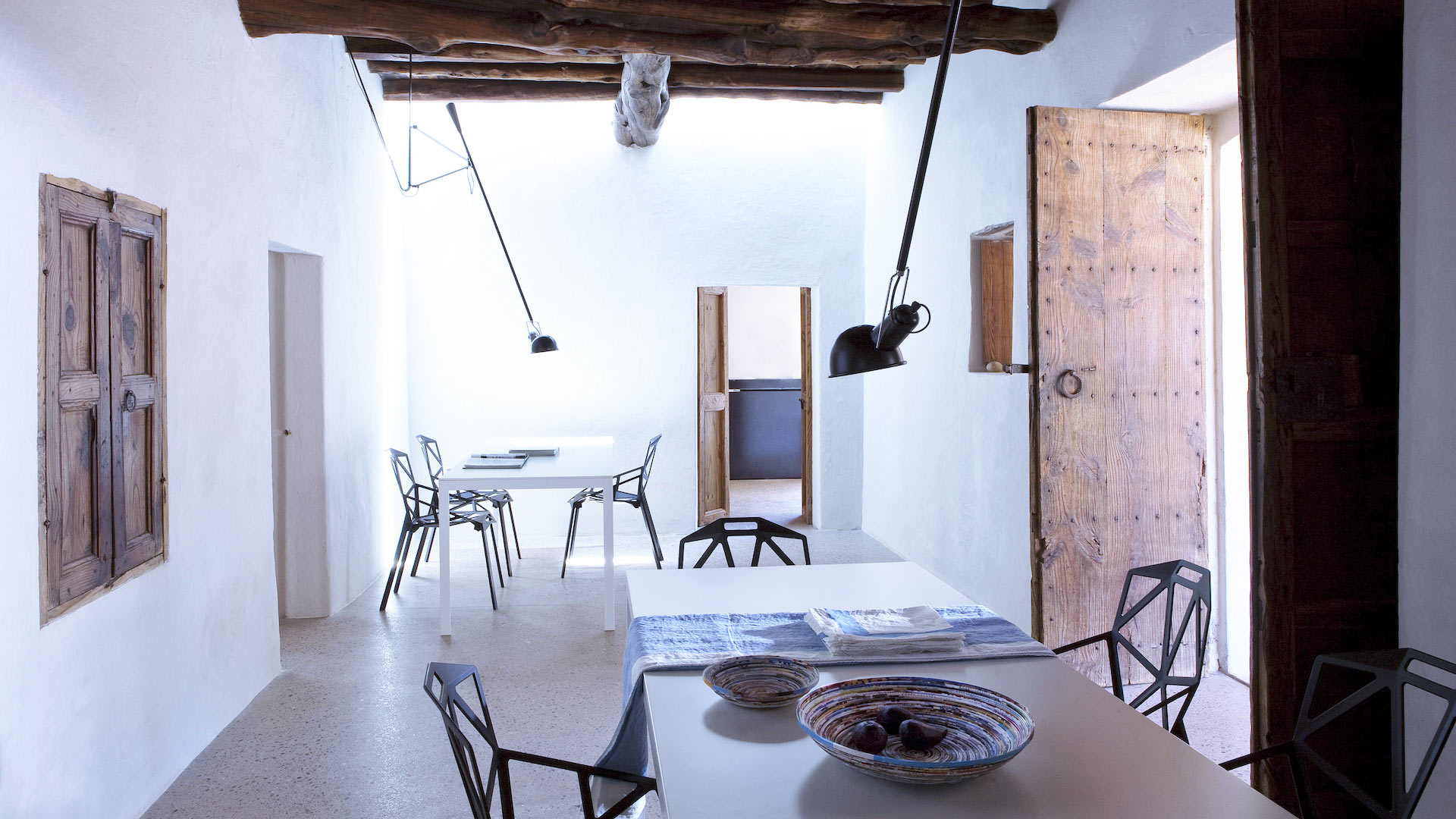 The two dining areas at Villa Can Basso in Ibiza including the breakfast bar