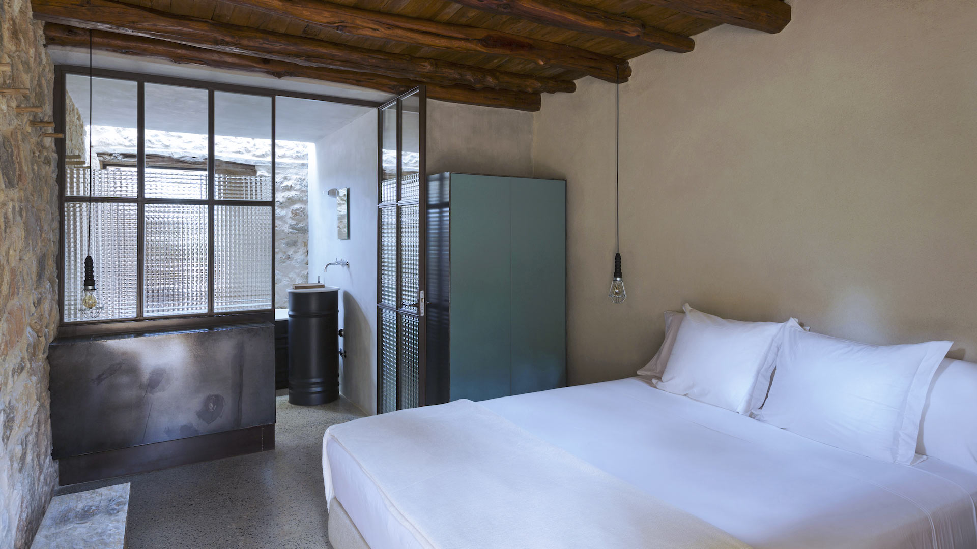 Bedroom at Villa Can Basso in Ibiza leading to the ensuite
