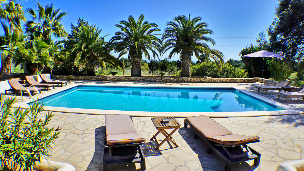 Poolside at the luxury villa rental Can Selena in Ibiza