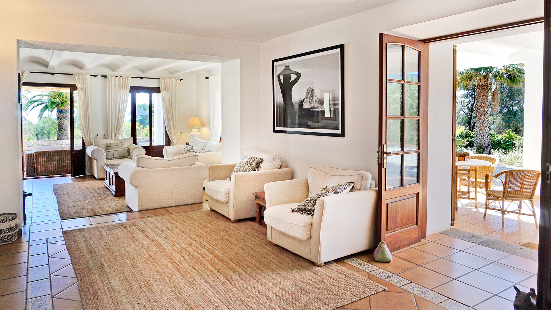 Living space with a door to the exterior at the luxury villa rental Can Selena in Ibiza