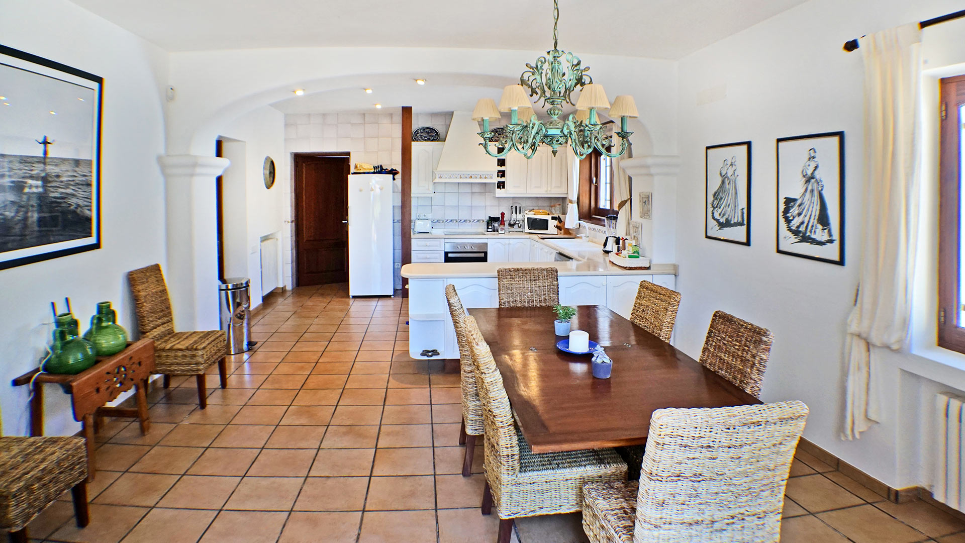 The inviting kitchen / dining space at the luxury villa rental Can Selena in Ibiza