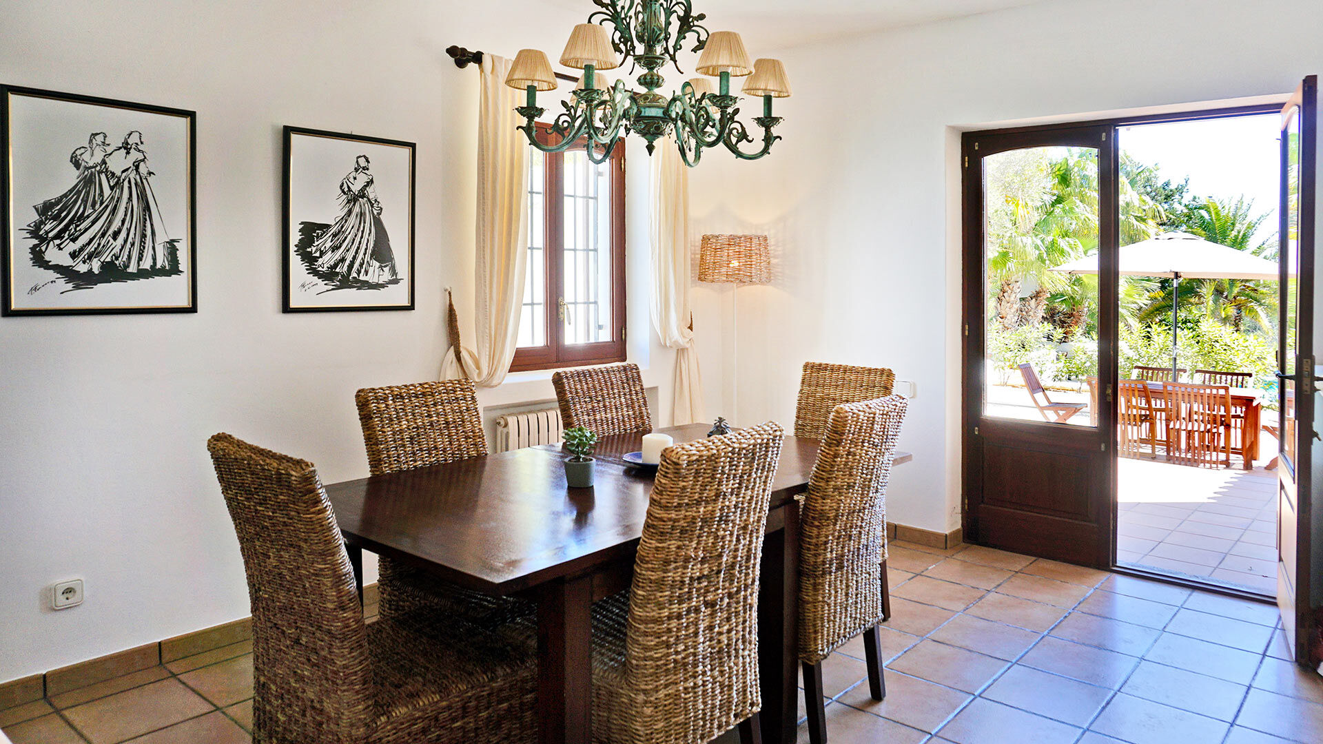 The dining area with beautiful open patio doors at the villa rental Can Selena in Ibiza