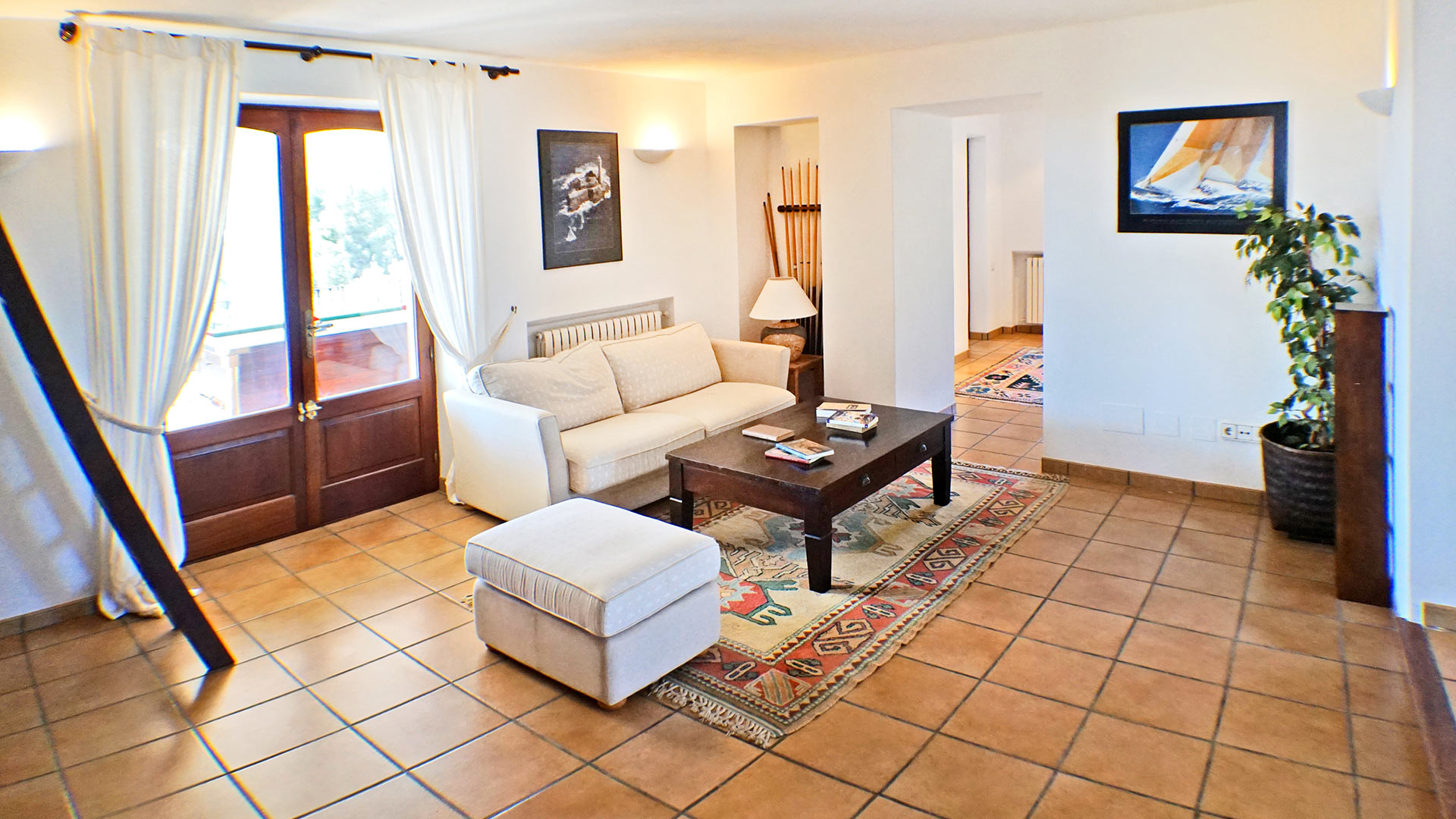 One of the living spaces and beautiful orange tile floor at the luxury villa rental Can Selena in Ibiza