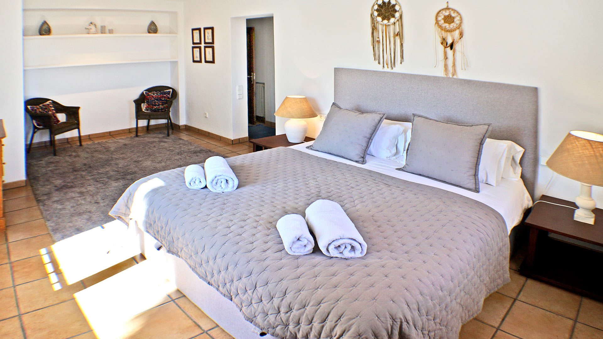 The cool toned bed set in the luxury villa rental Can Selena in Ibiza