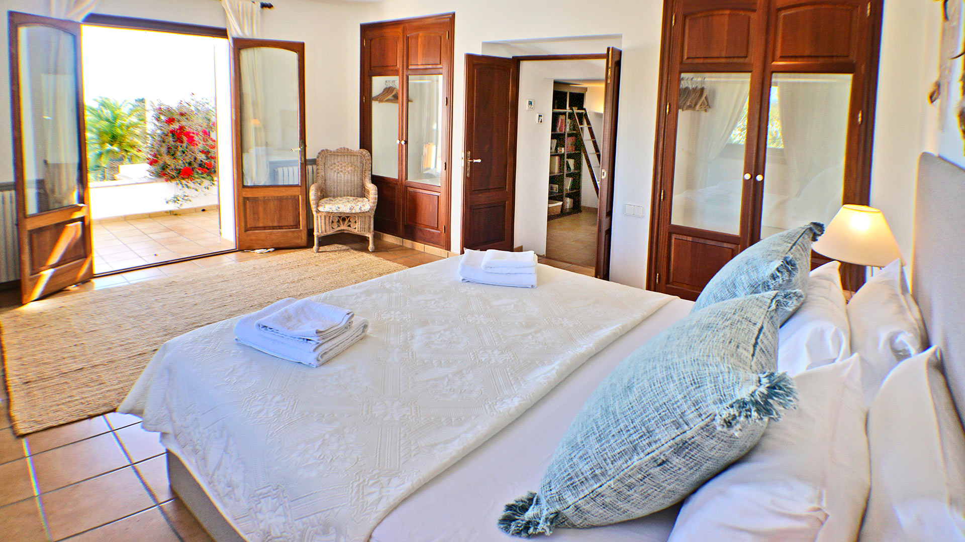 The open patio doors in one of the bedrooms in the luxury villa rental Can Selena in Ibiza