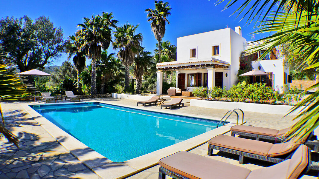 Sunloungers around the pool at the luxury villa rental Can Selena in Ibiza