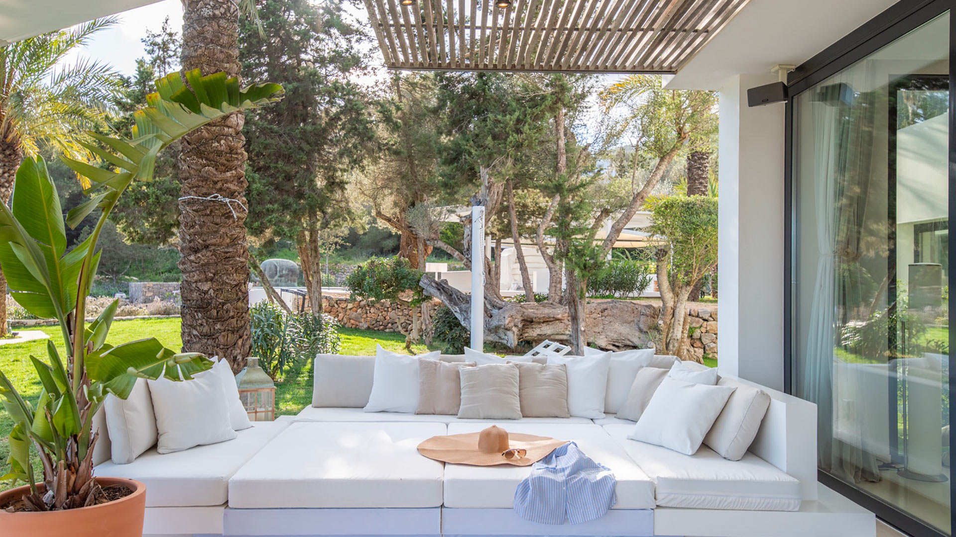 Large comfortable white seating area under a shaded awning at Villa Casa Isa in Ibiza