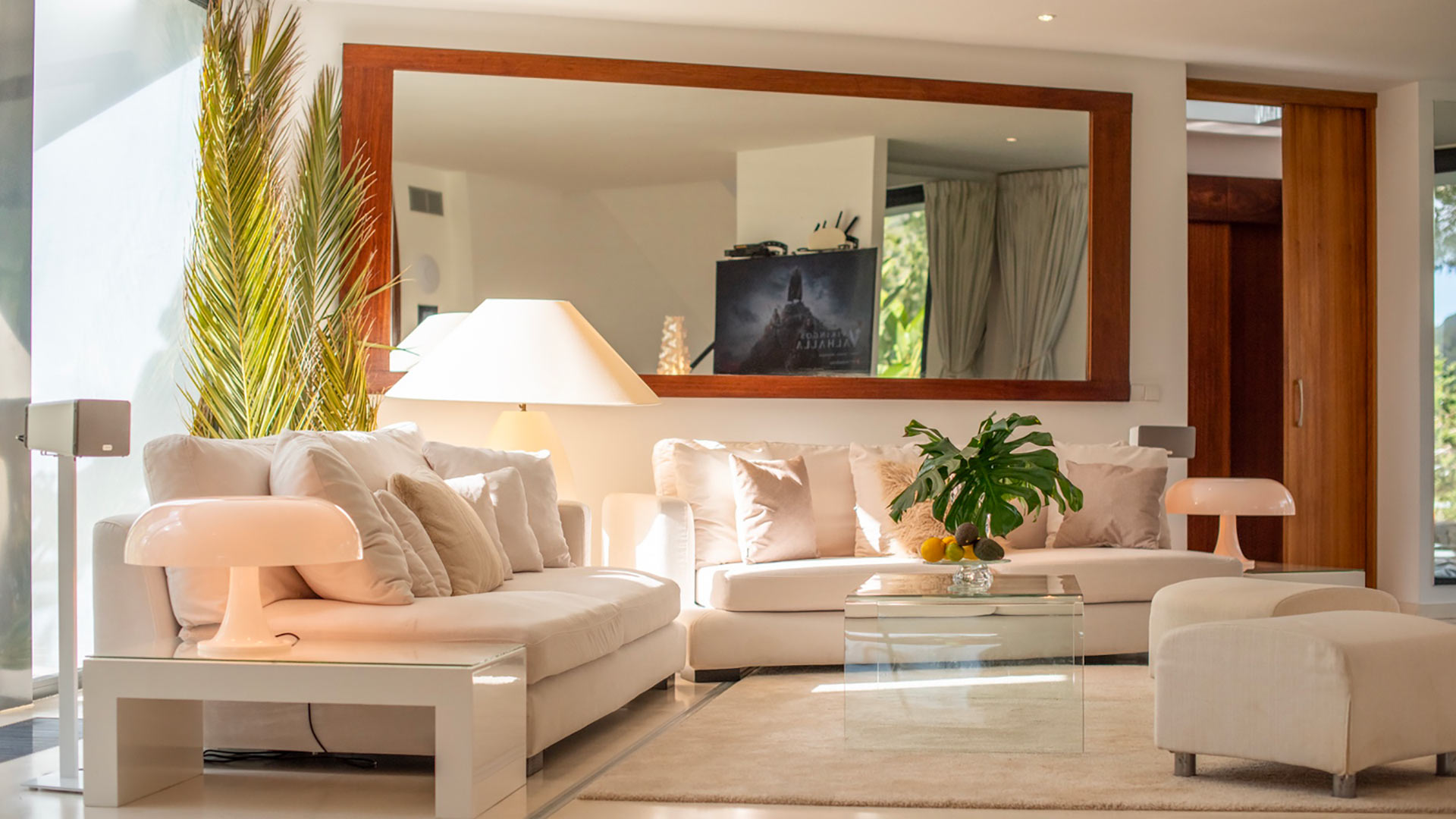 Living space at Villa Casa Isa in Ibiza with a huge mirror and soft neutral furnishing