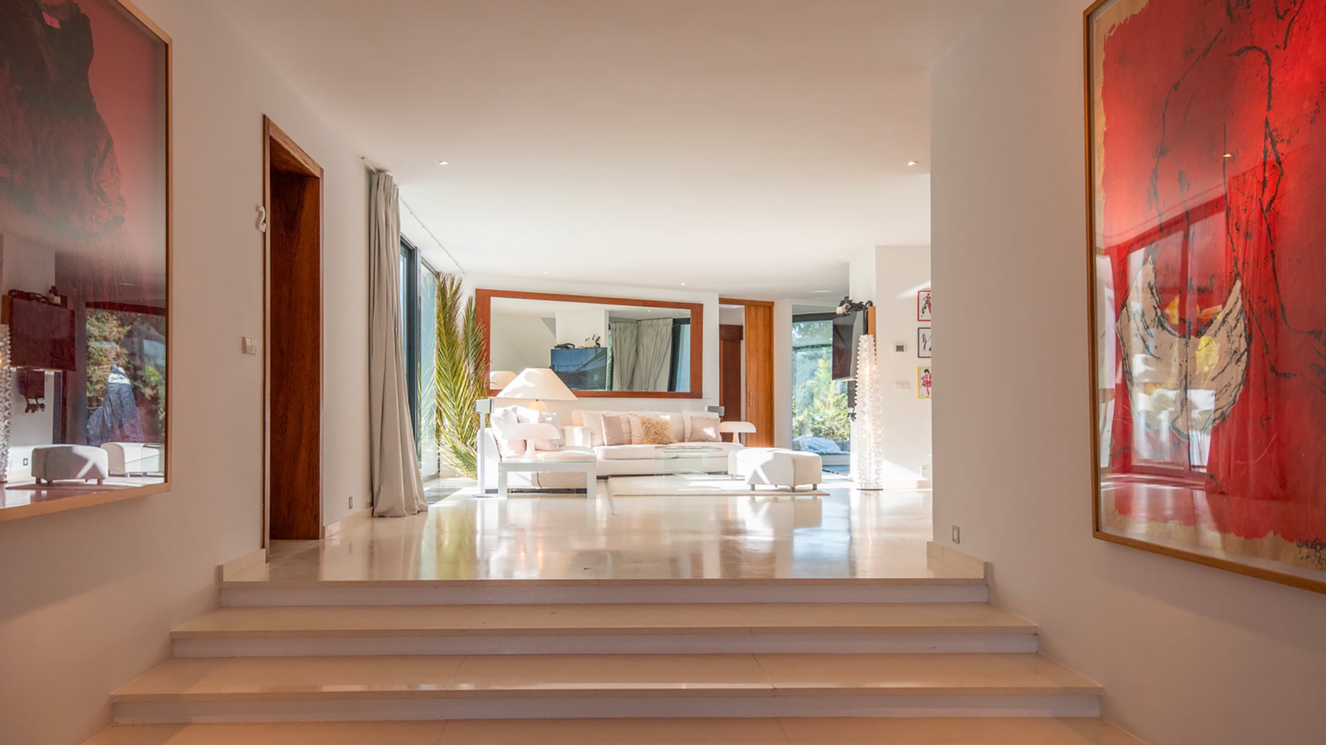 Art adorned walls leading up to the living space at Villa Casa Isa in Ibiza