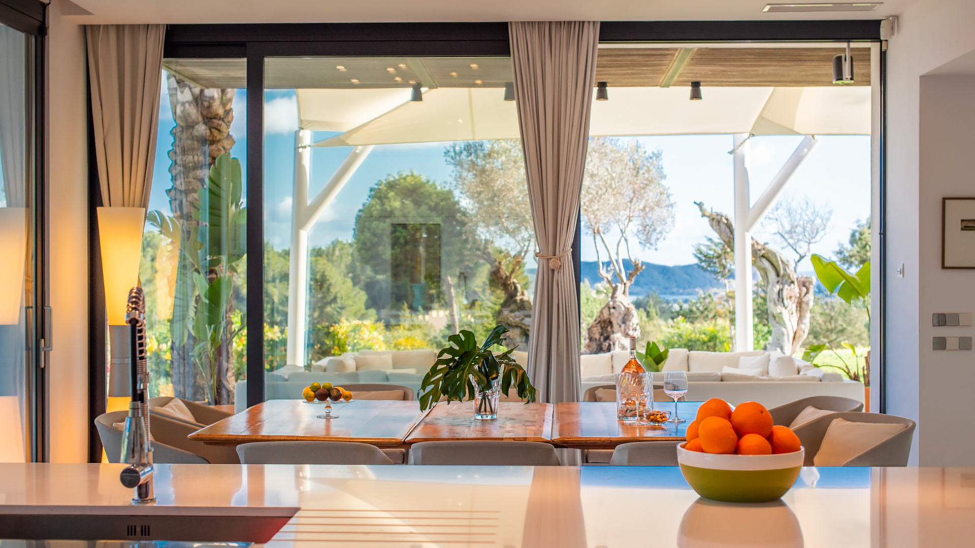 Large floor to ceiling windows in the dining room at Villa Casa Isa in Ibiza