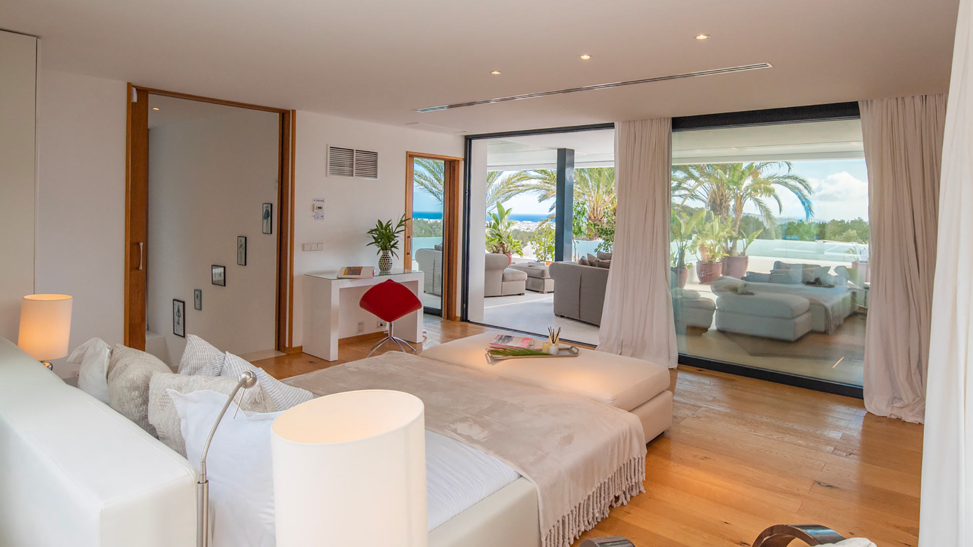 One of the large bedrooms with patios straight to the beautiful pool at Villa Casa Isa in Ibiza