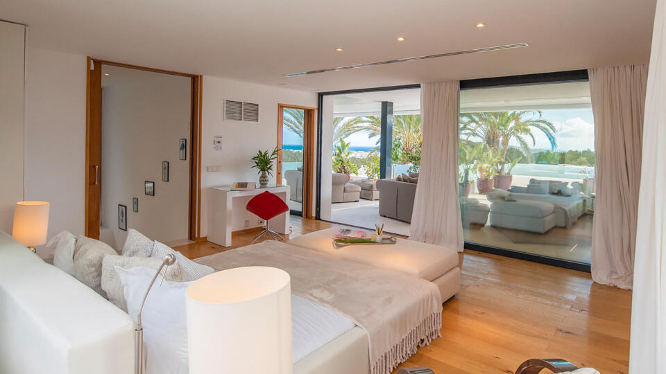 One of the large bedrooms with patios straight to the beautiful pool at Villa Casa Isa in Ibiza