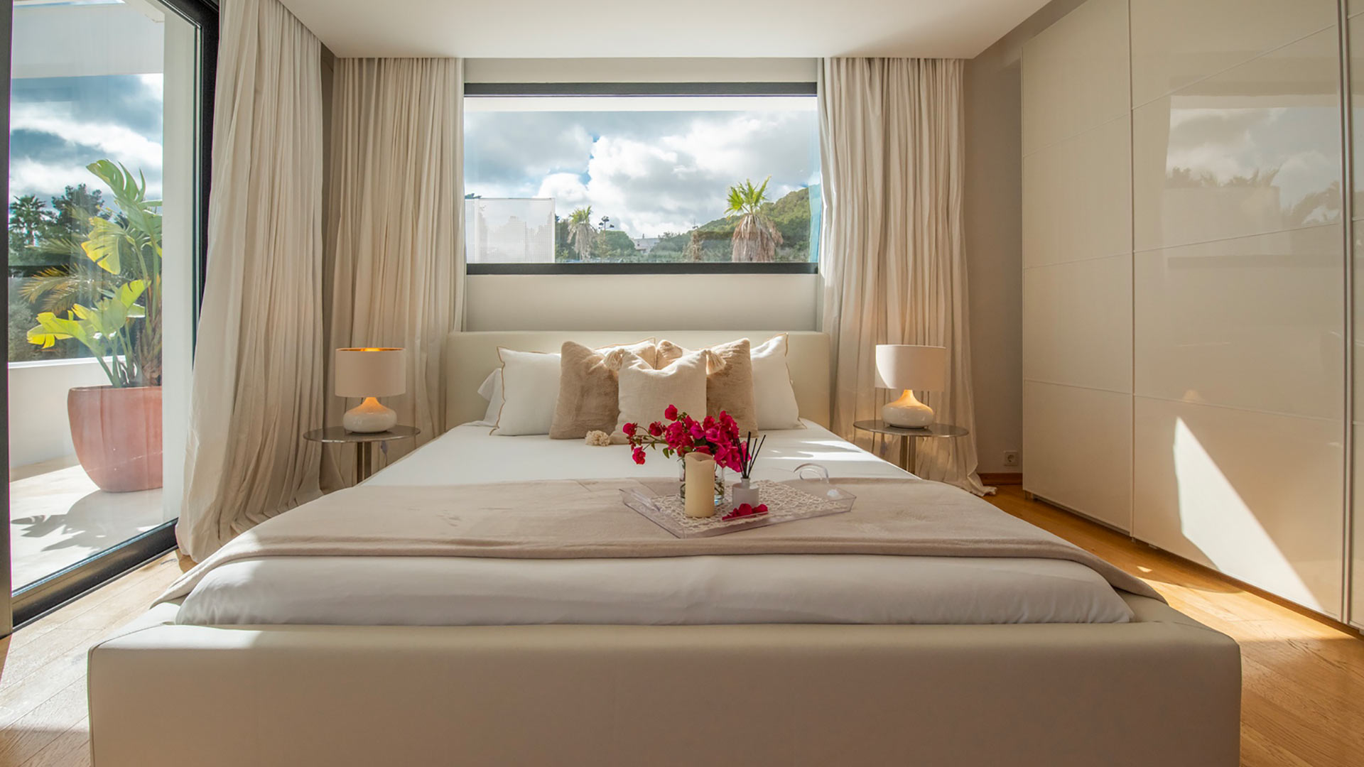 Small vase of red roses on one of the bedrooms at Villa Casa Isa in Ibiza with plenty of natural light