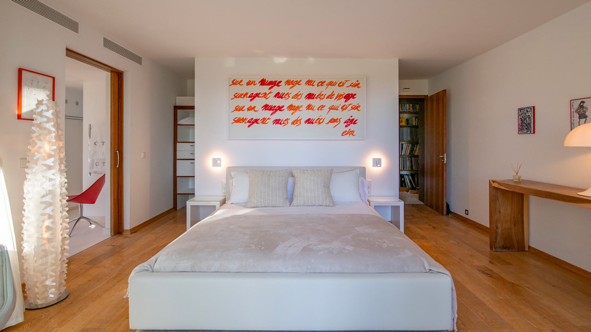 One of the bedrooms with red accents throughout at Villa Casa Isa in Ibiza