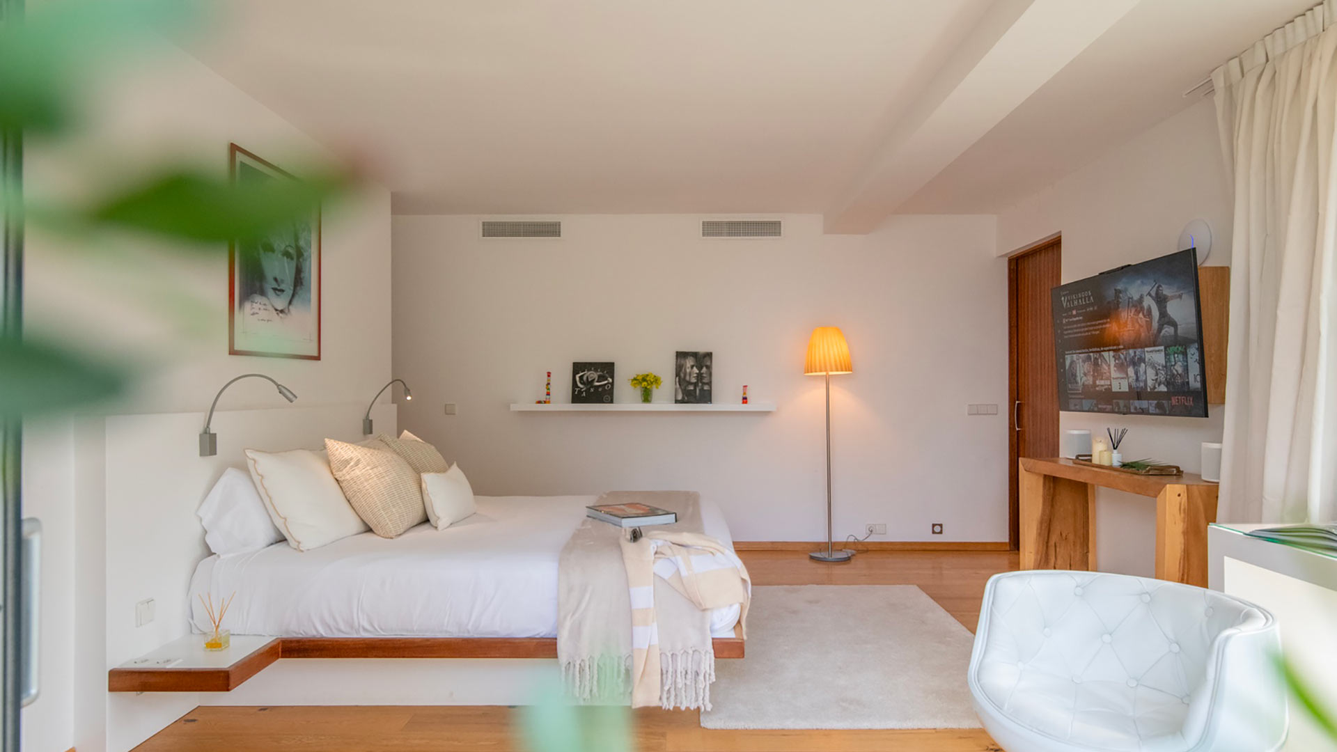 View from one of the windows into a large bedroom in the luxury Villa Casa Isa in Ibiza