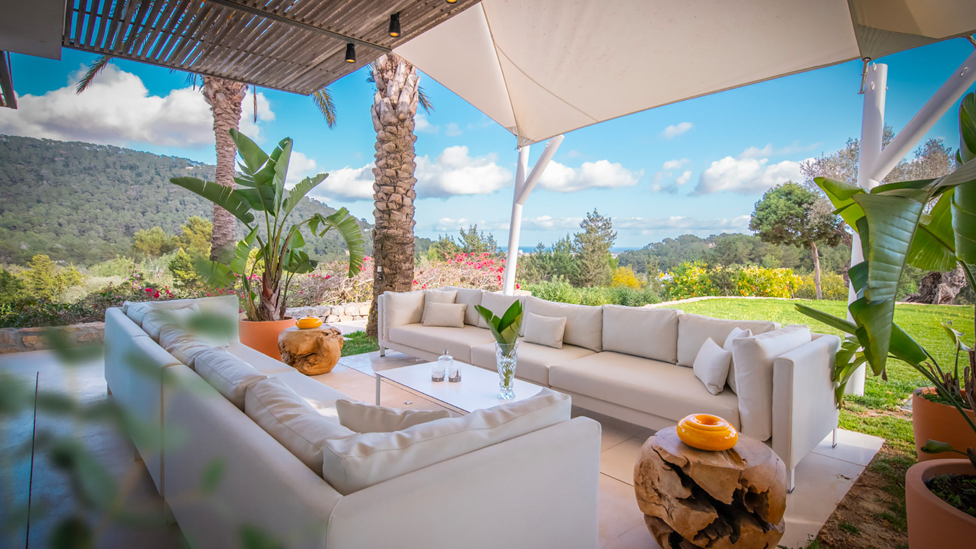 Shaded pergola with plenty of comfortable seating at Villa Casa Isa in Ibiza