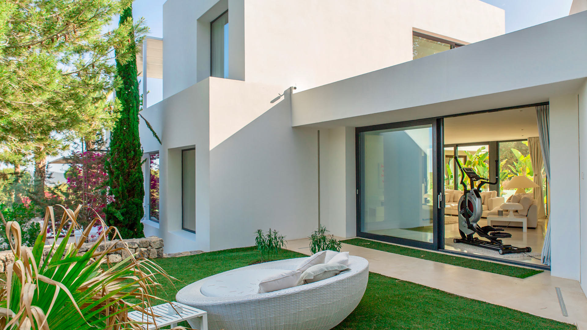Side exterior view of Villa Casa Isa with gym equipment