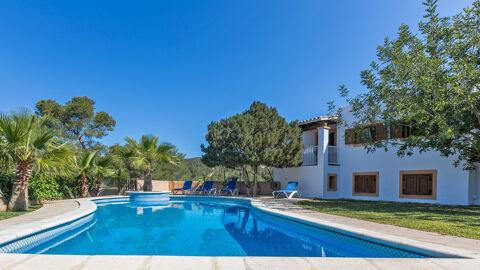 The deep blue pool at the luxury Villa Es Graner in Ibiza