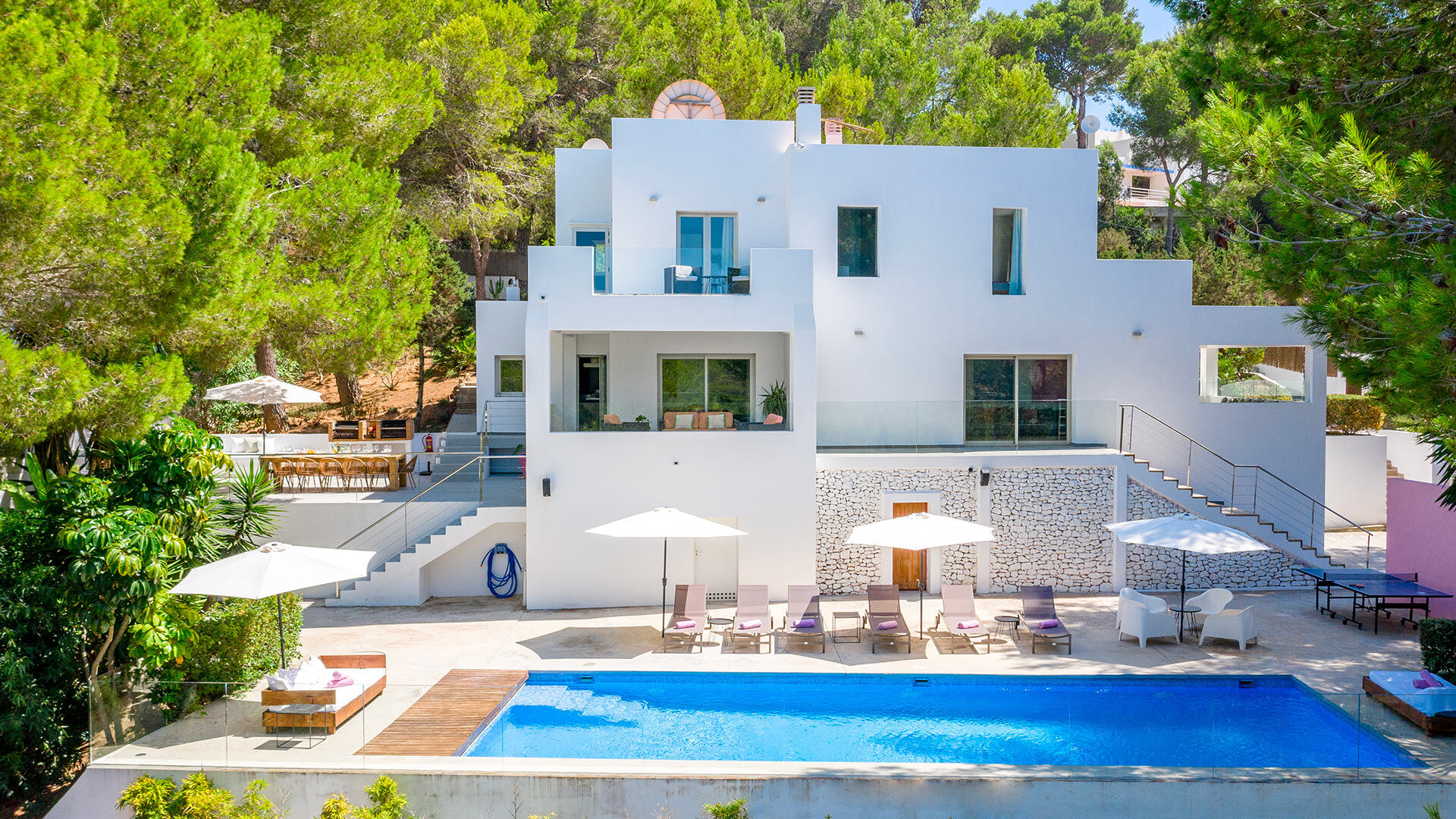 Rear exterior of luxury Villa Fabrik in Ibiza and the beautiful pool