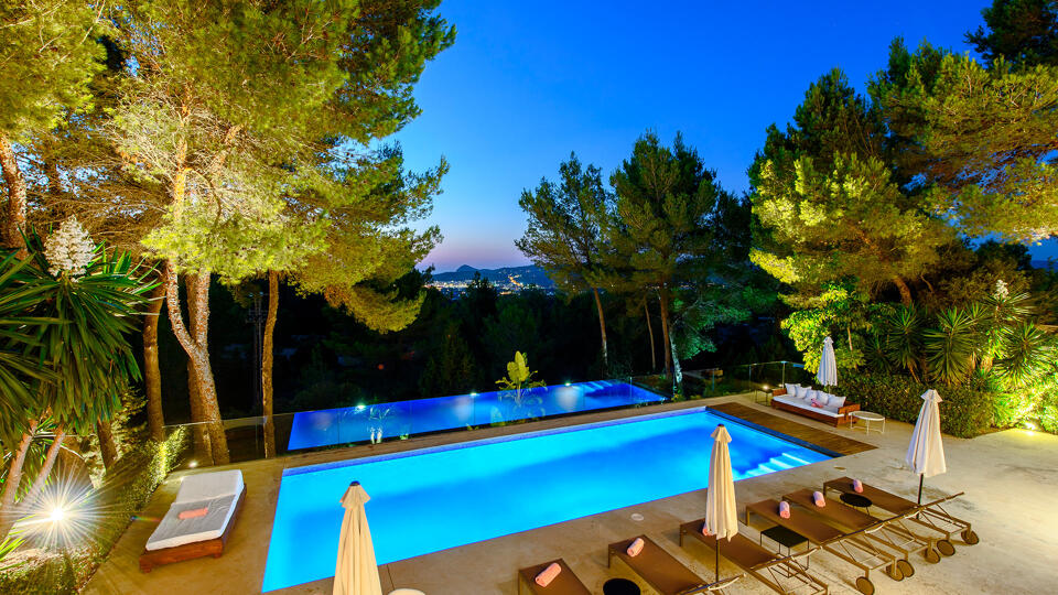 Nighttime shot of the gardens of luxury Villa Fabrik in Ibiza