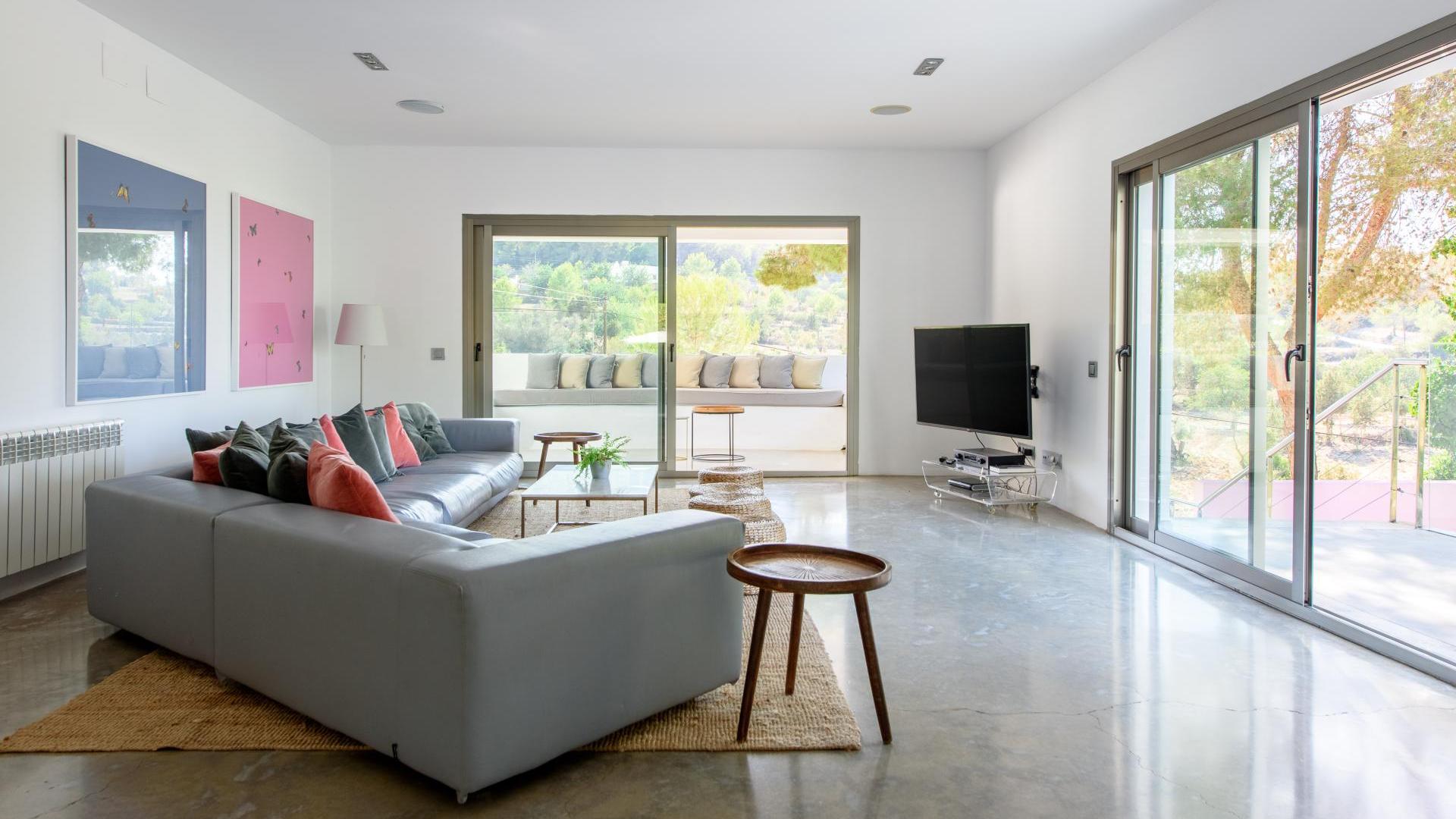 Lounge area with the beautiful patio doorways letting in natural sunlight