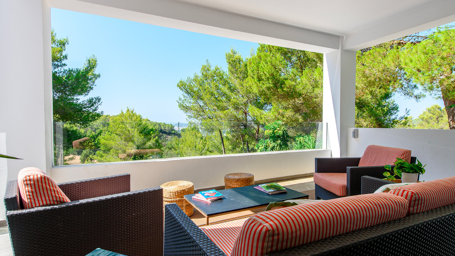 Exterior shaded lounging area with relaxing and inviting seating at Villa Fabrik