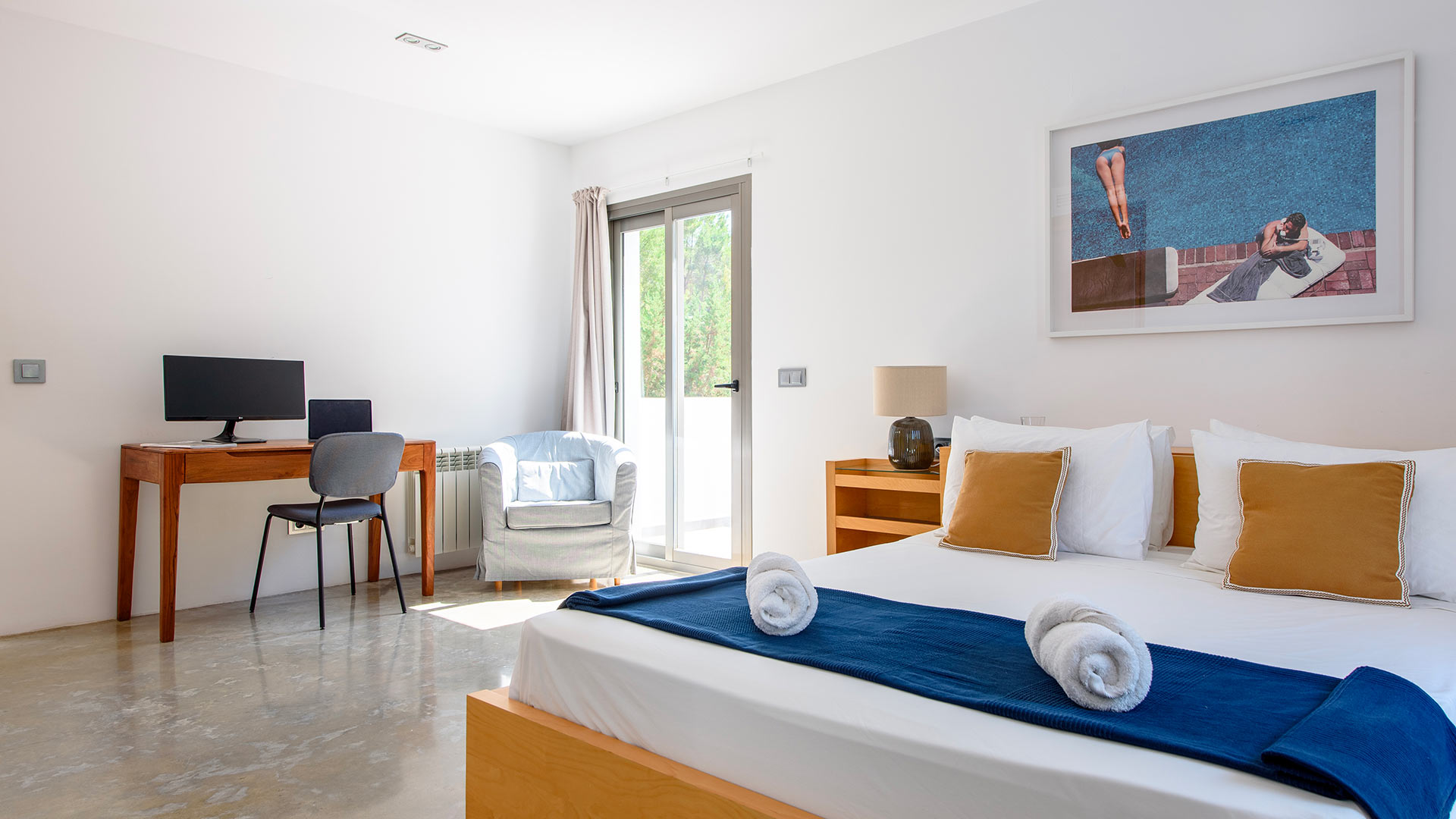 Large bedroom at Villa Fabrik with patio to the exterior 