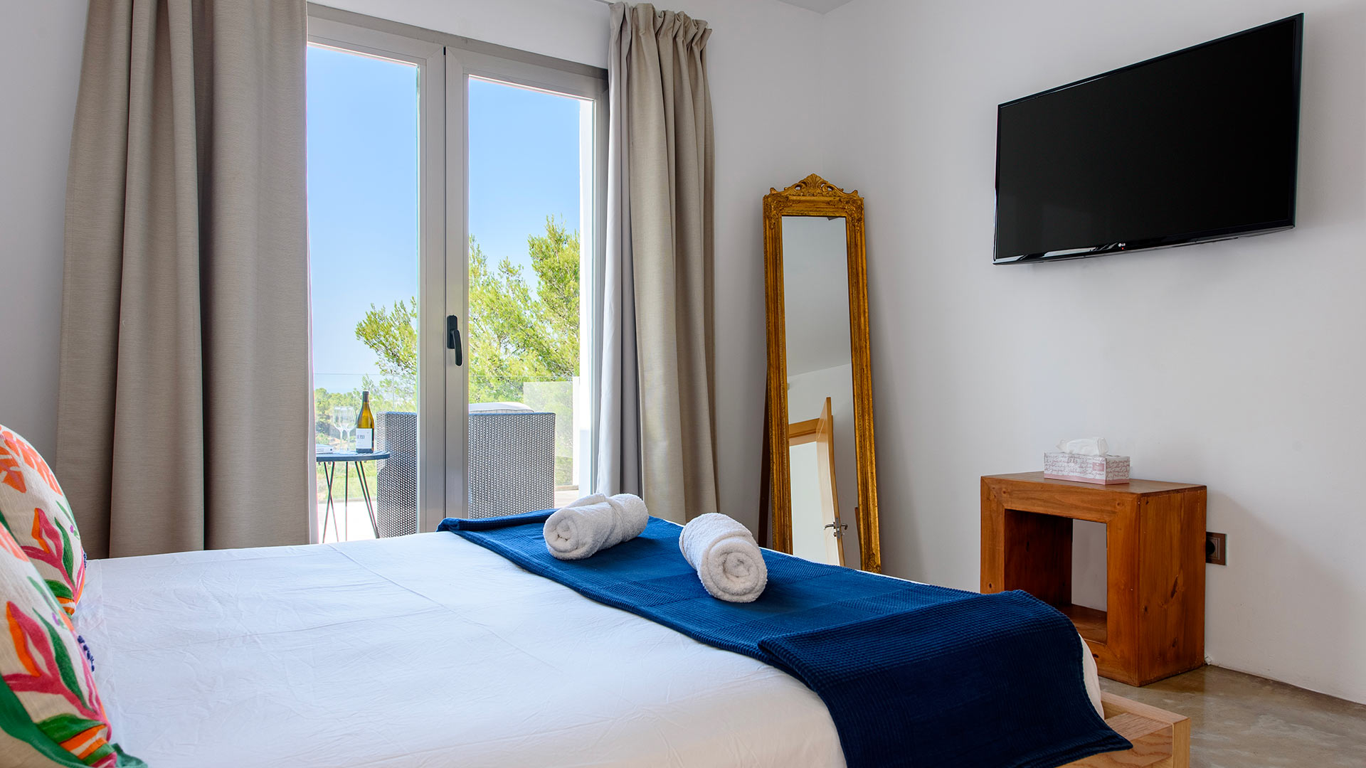 Bedroom with incredible views from the patio doors at Villa Fabrik in Ibiza