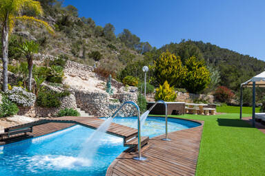 The manicured lawn of Villa Fountain Ibiza at the beautiful tree lined hill