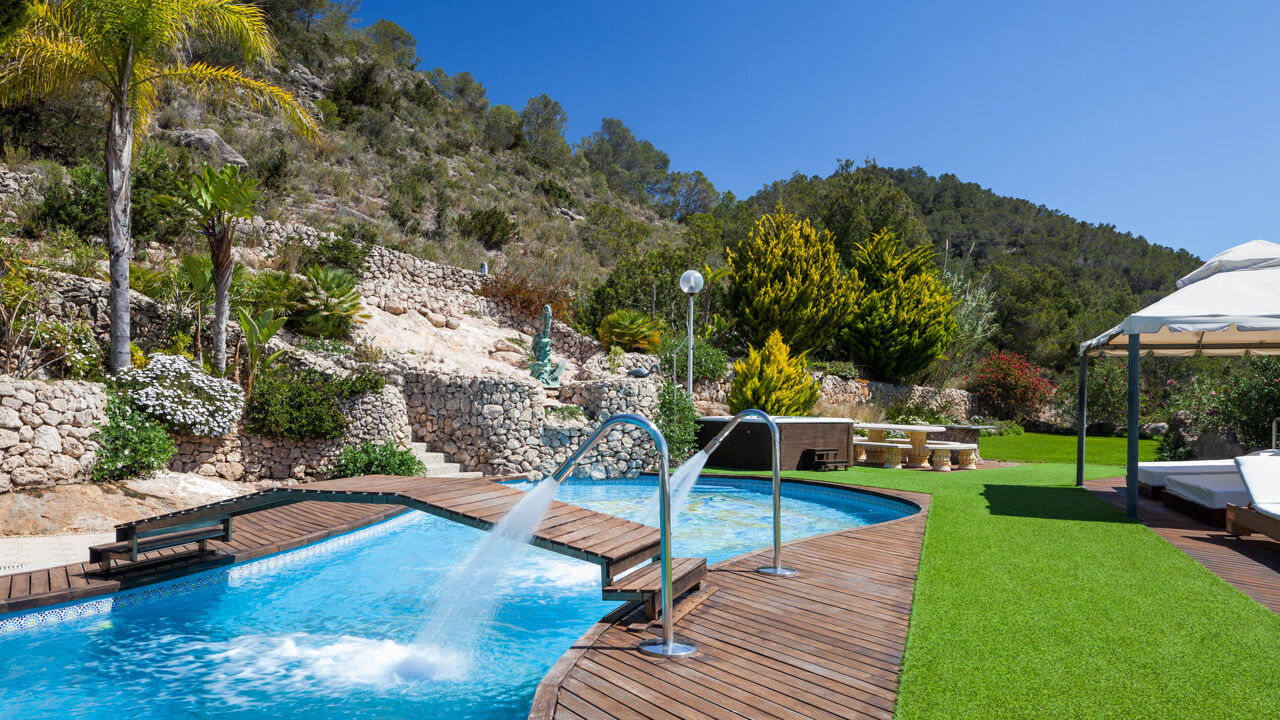 The manicured lawn of Villa Fountain Ibiza at the beautiful tree lined hill