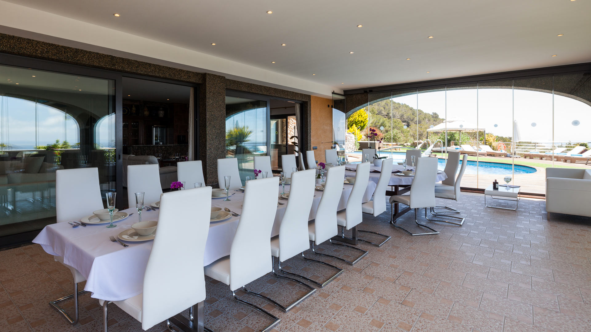 Extended dining table under the shade ideal for large families or friends at Villa Fountain Ibiza