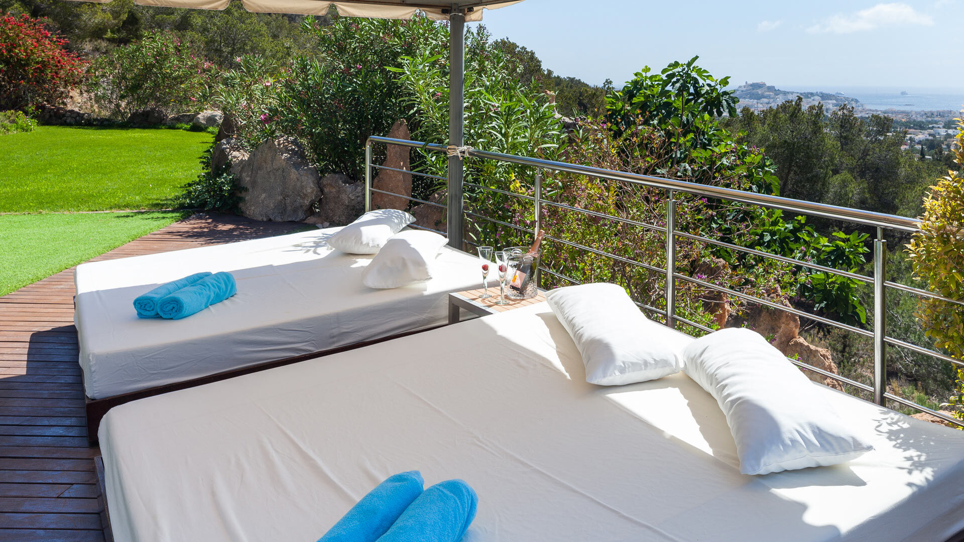 Shaded daybeds overlooking the town at Villa Fountain Ibiza